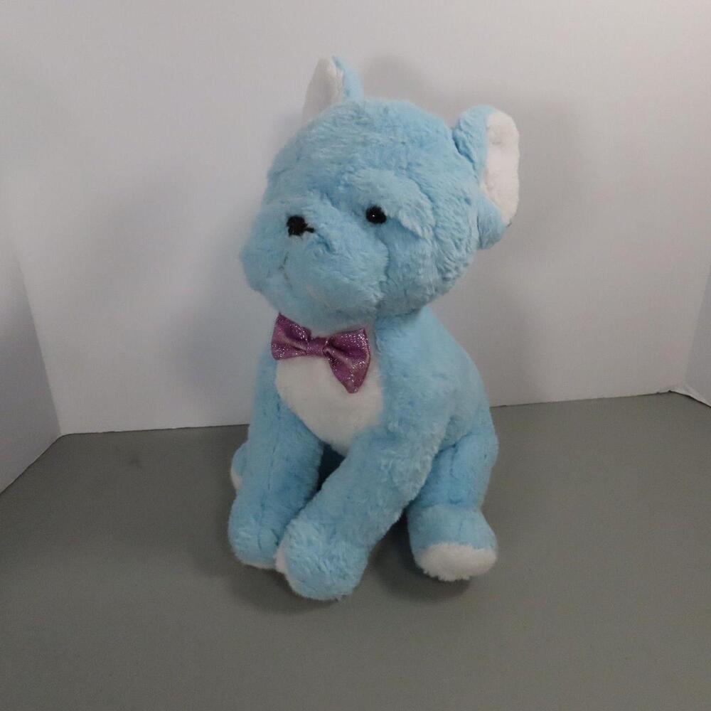 The FAO Schwarz Blue Cat Plush Stuffed Animal is a charming 10-inch toy adorned